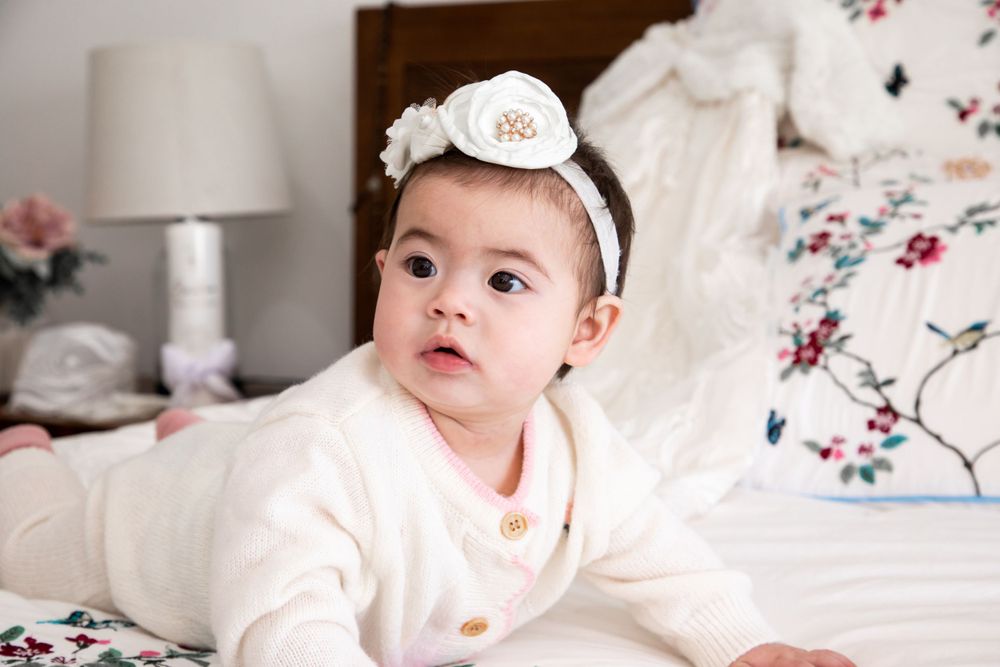 baby on christening with mother and father and godmother