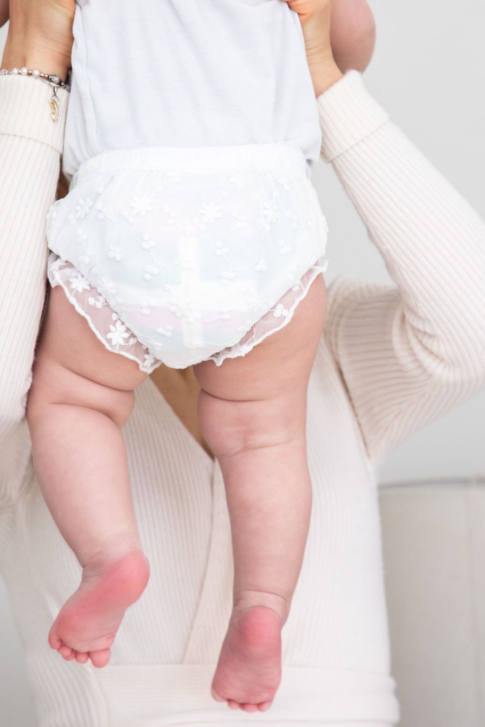 baby on christening with mother and father and godmother