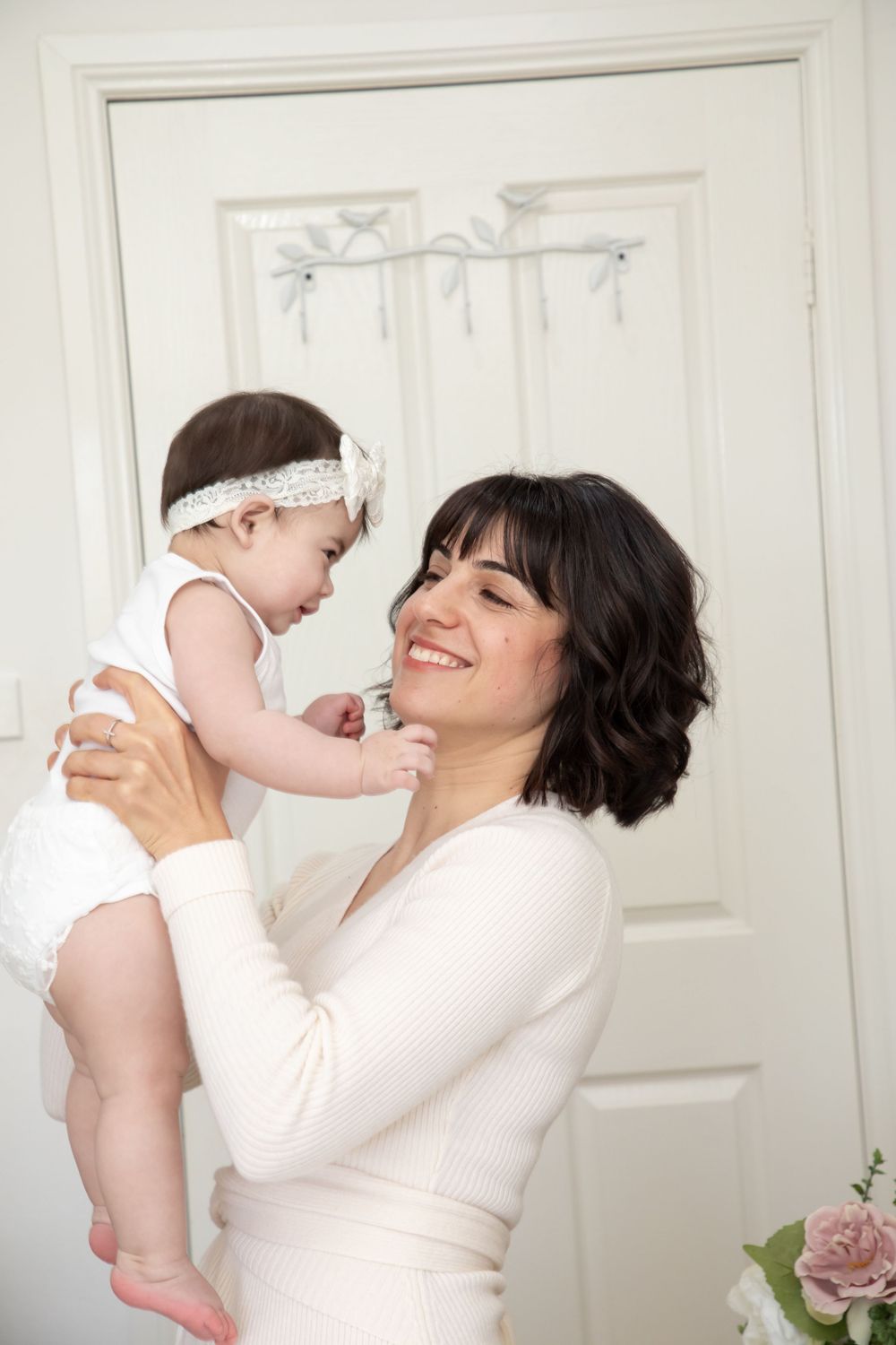 baby on christening with mother and father and godmother