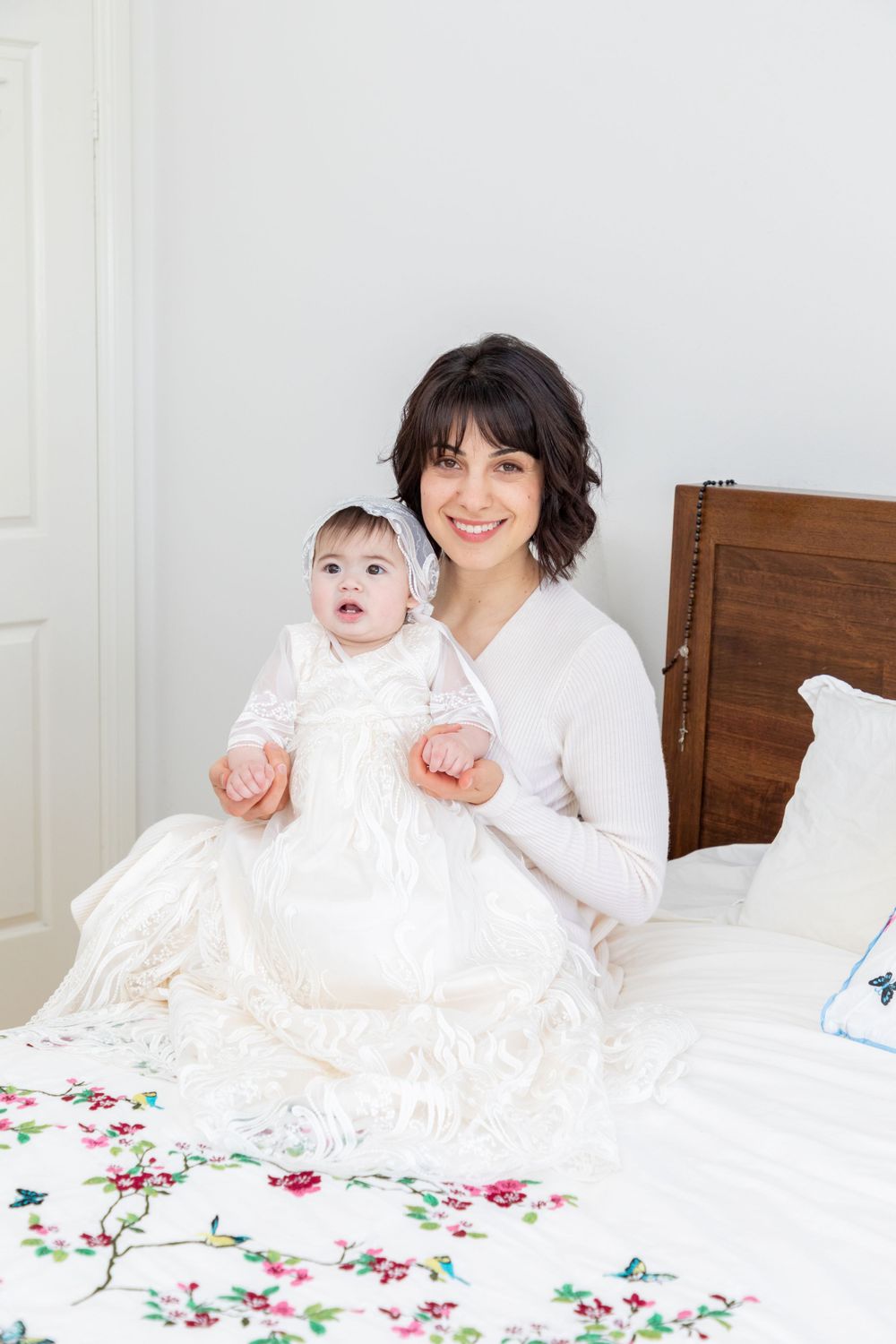 baby on christening with mother and father and godmother