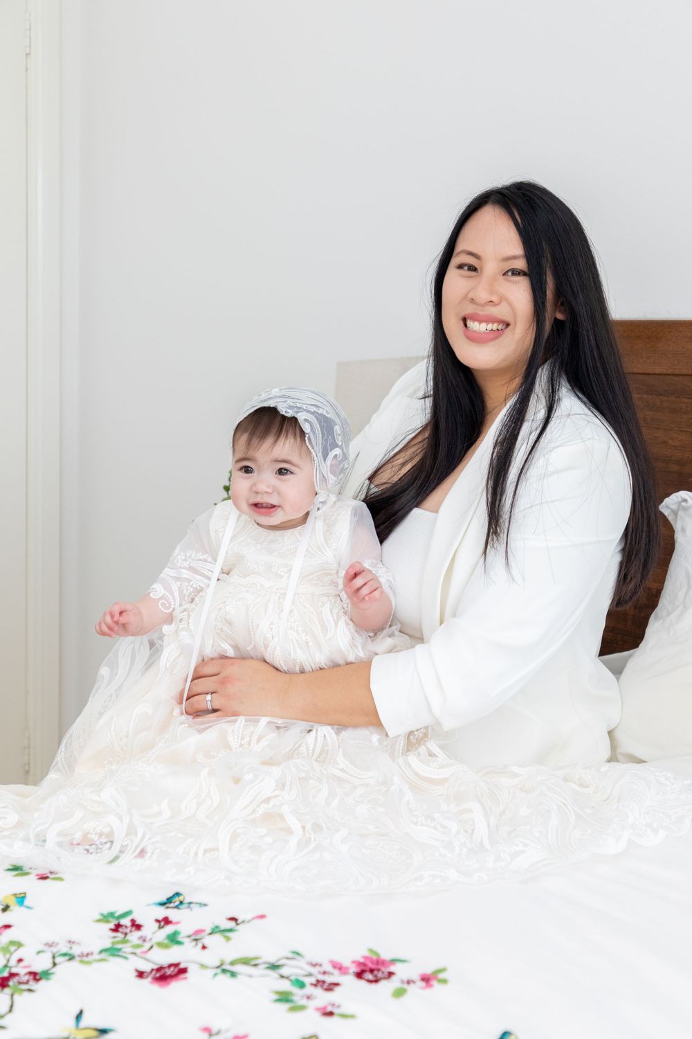 baby on christening with mother and father and godmother
