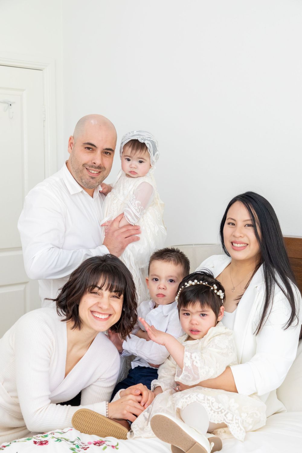 baby on christening with mother and father and godmother