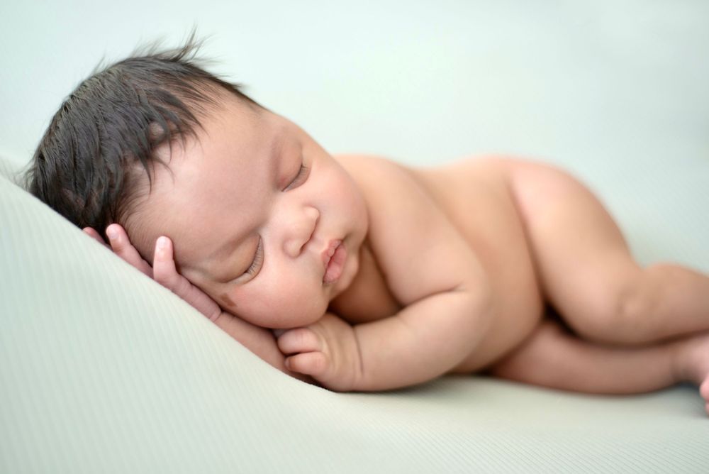 Newborn baby boy pose