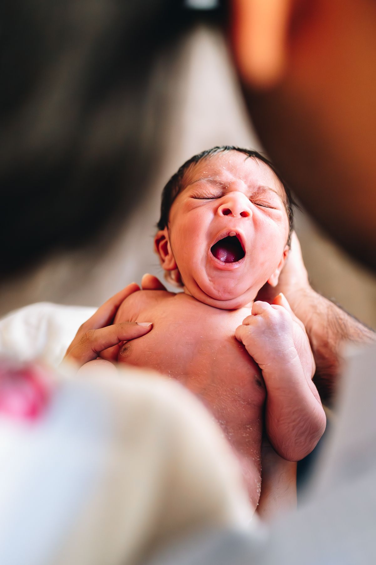 Newborn yawning during a newborn and family photoshoot in Melbourne by a Melbourne maternity, newborn and family photographer in Melbourne