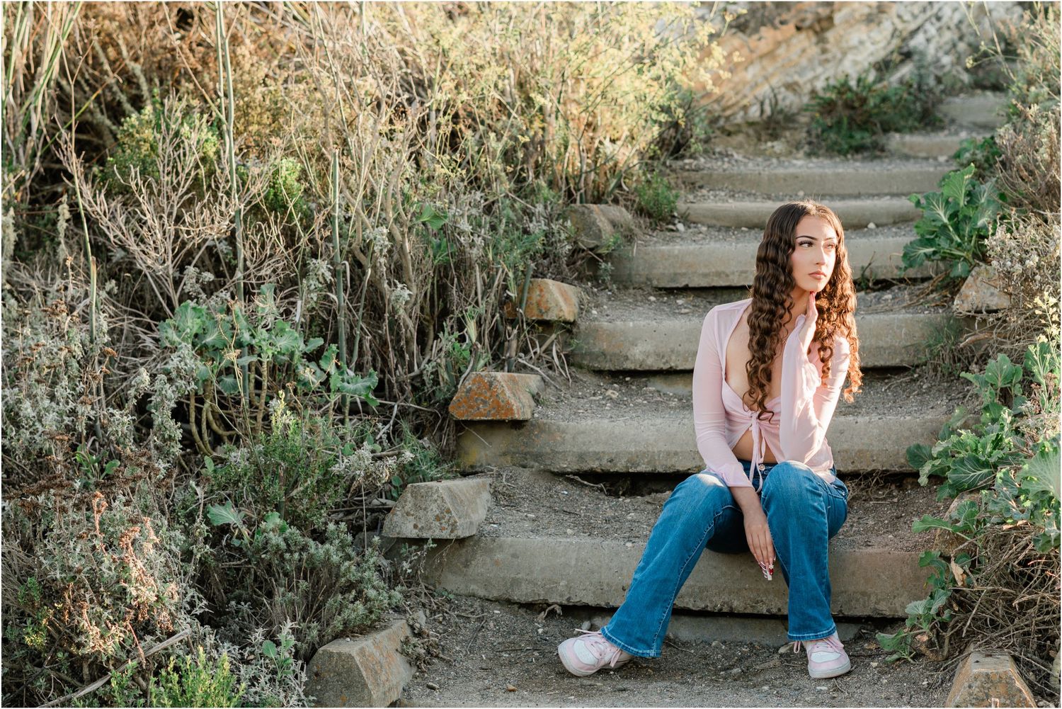 slo high senior portraits wearing pink shirt and jeans for casual look at montana de oro