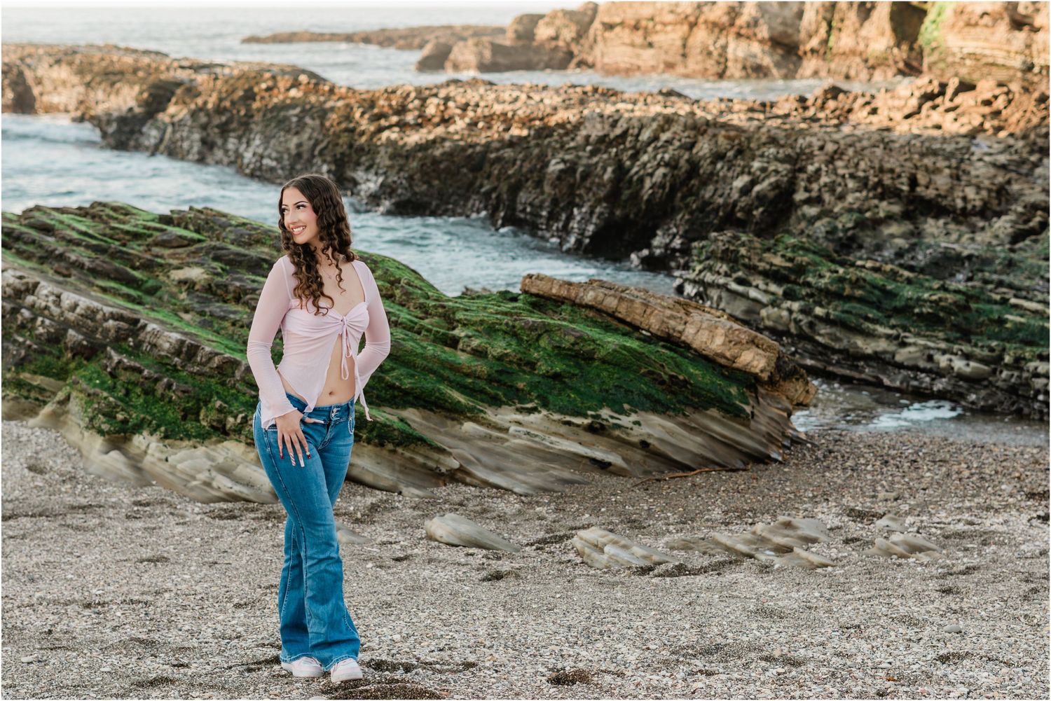cute slo high senior girl wearing a pink shirt for senior photos done at montana de oro with felisha connolly photography