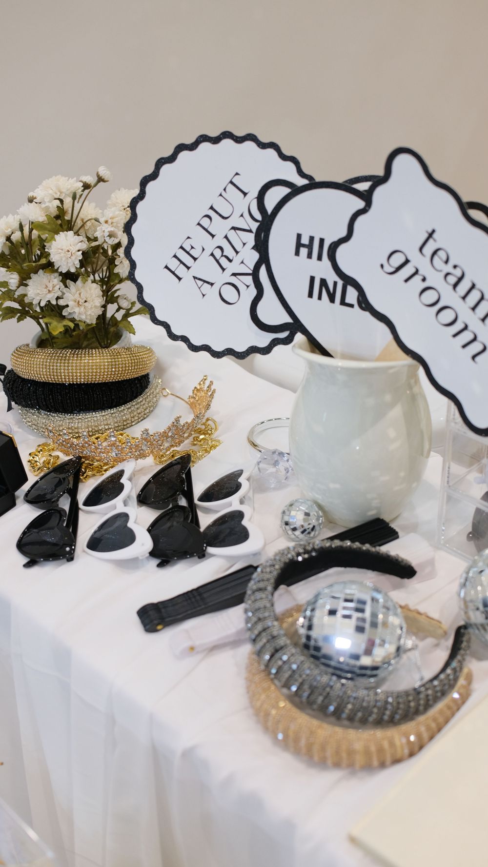Party props display with heart-shaped sunglasses, floral decorations, and disco ball accents. Perth WA Photo booth Hire Event Booth