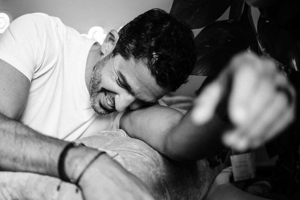 Intimate black and white moment captured in natural lighting.