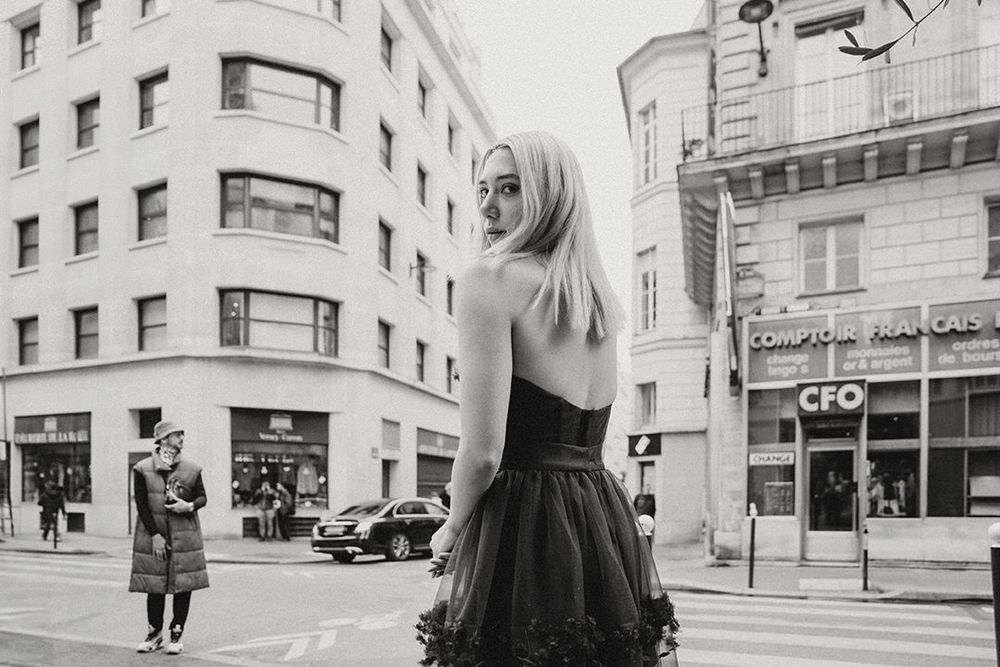 Street style black and white photograph in urban setting.