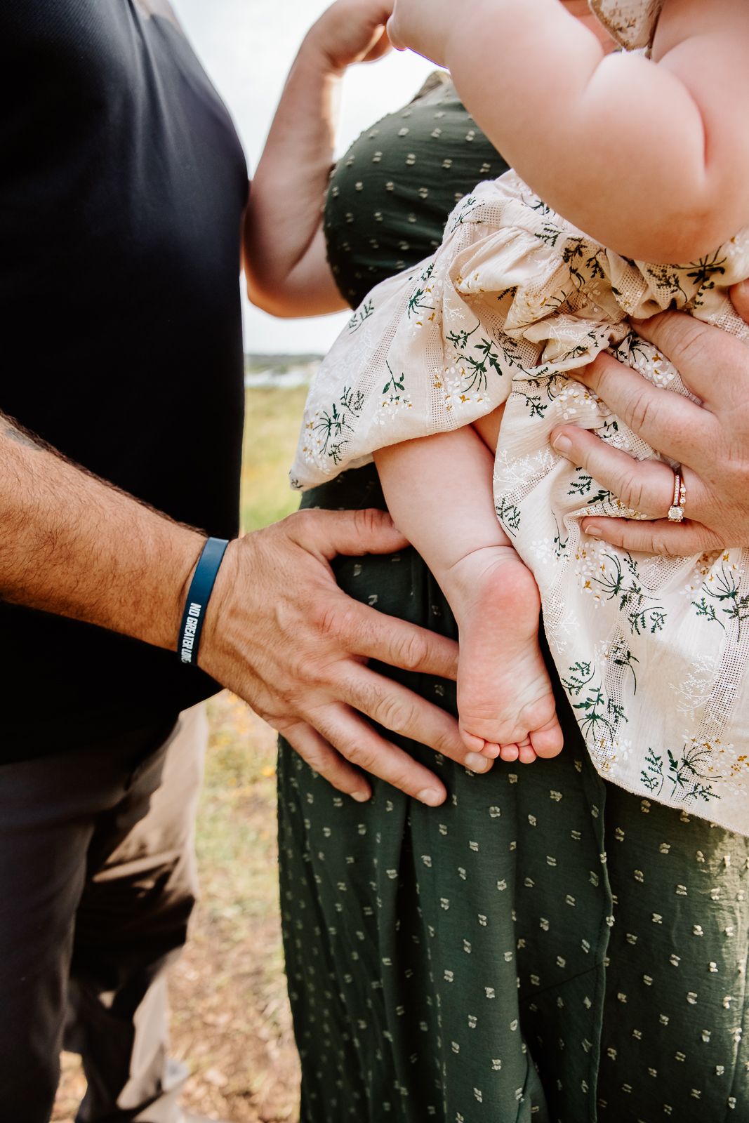 Intimate baby bump photo with mom and dad’s hands, Austin family photographer session