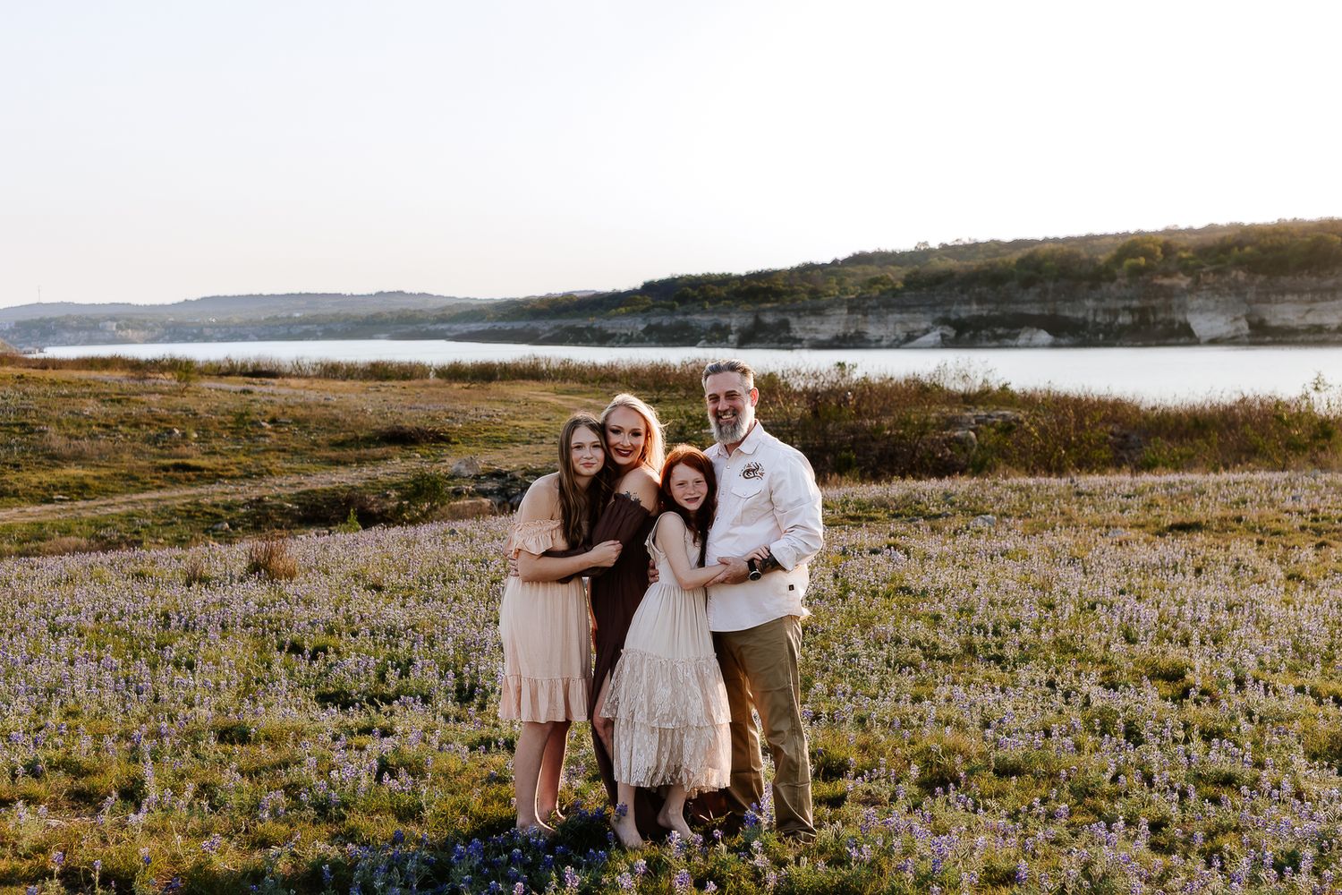 Family enjoying outdoor photo session at Lake Travis, Austin, photographed by family photographer