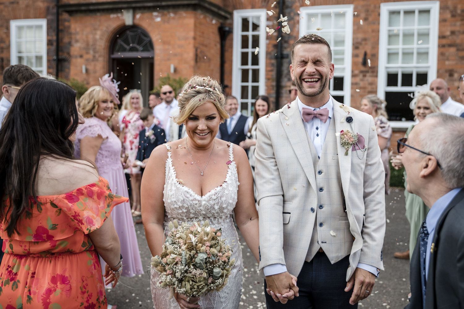 Bride & Groom at Kelham House, natural candid confetti photo.