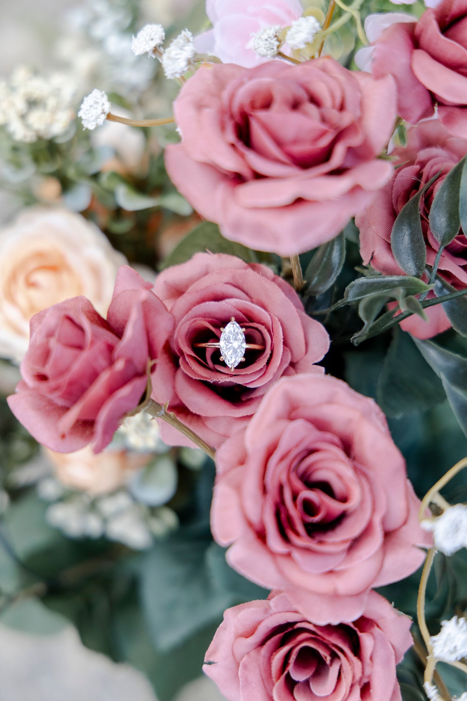 Detail shot of ring in flowers for Dripping Springs engagement proposal.