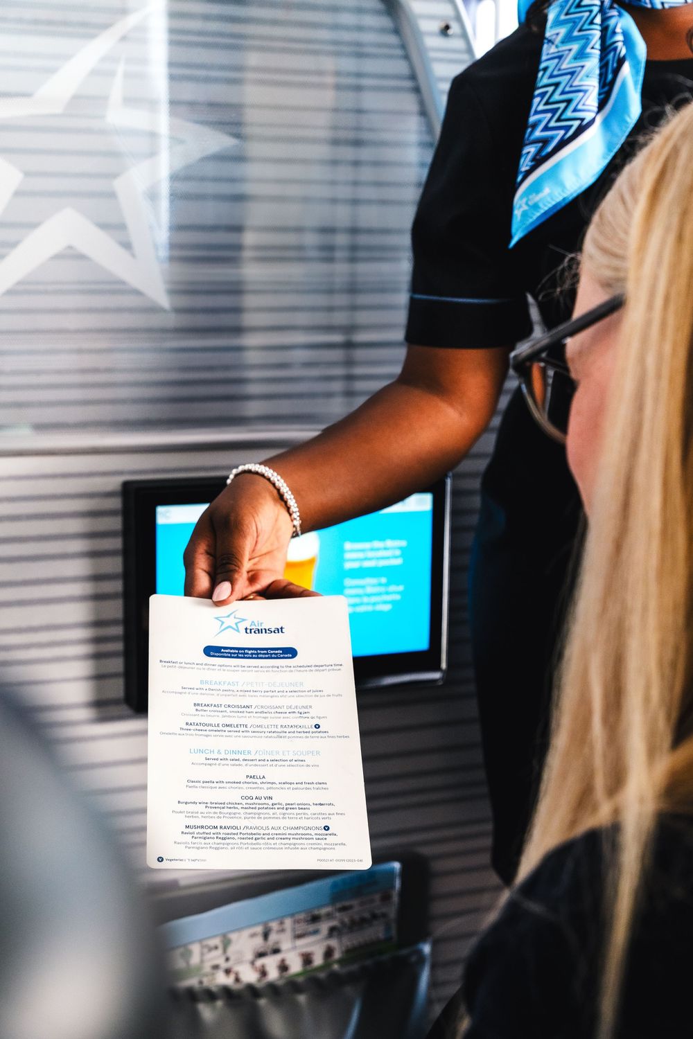 A close-up shot of hands holding administrative documents in an office setting with light shining through.