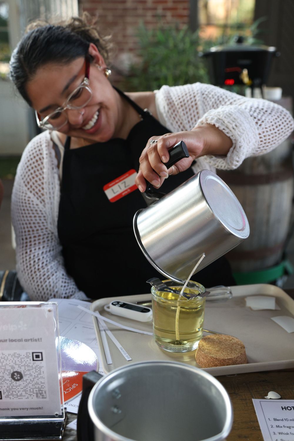A sequence of images showing someone carefully pouring hot water into a glass teacup from a metal kettle.