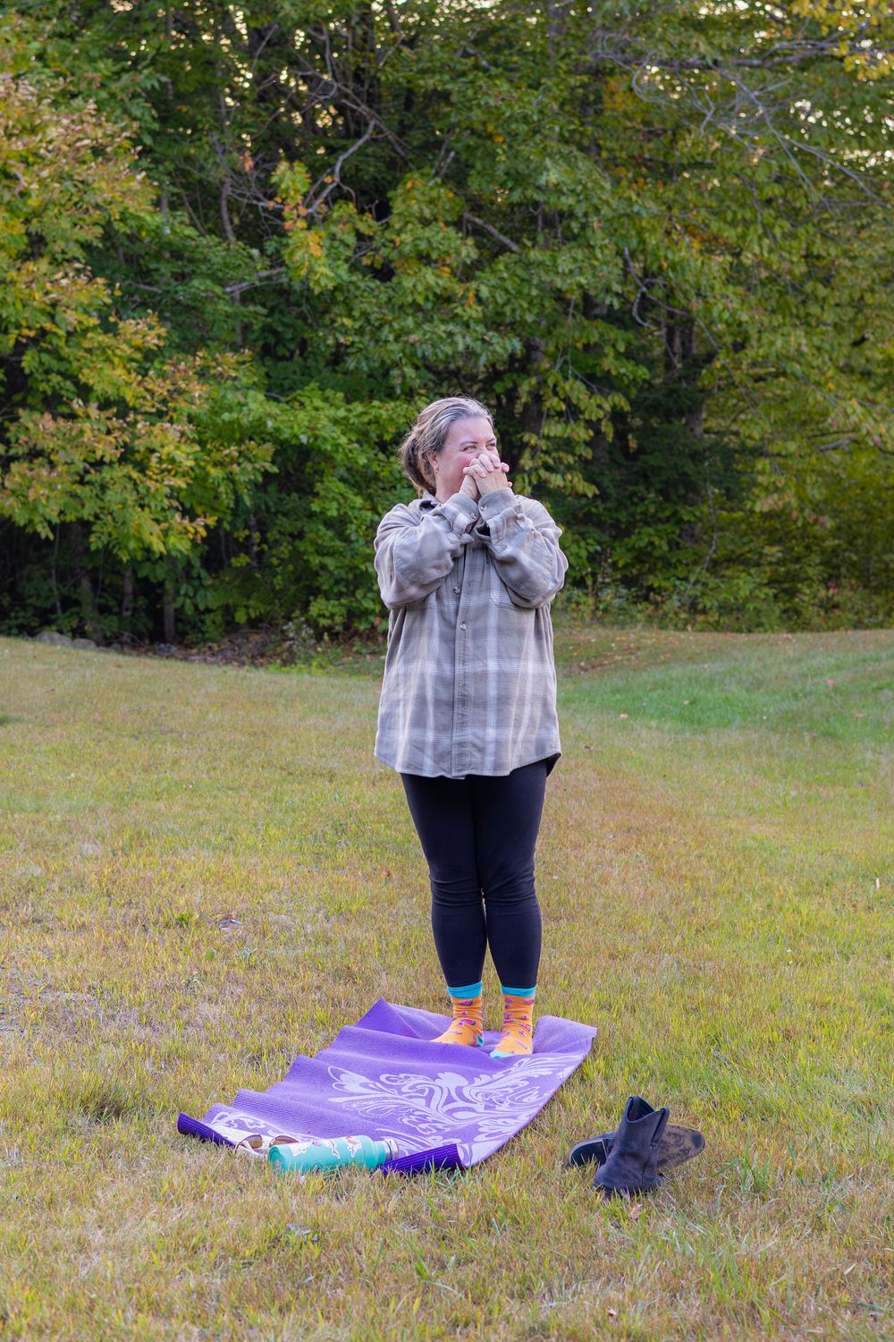 A purple picnic blanket laid out on grass with snacks and shoes visible in a series of outdoor shots.