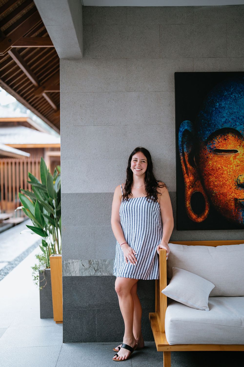 Luxury villa interior featuring modern furniture and colorful Buddha wall art.