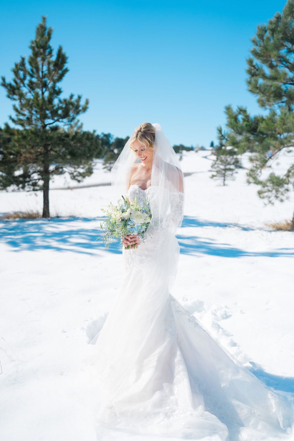 bride standing in snow