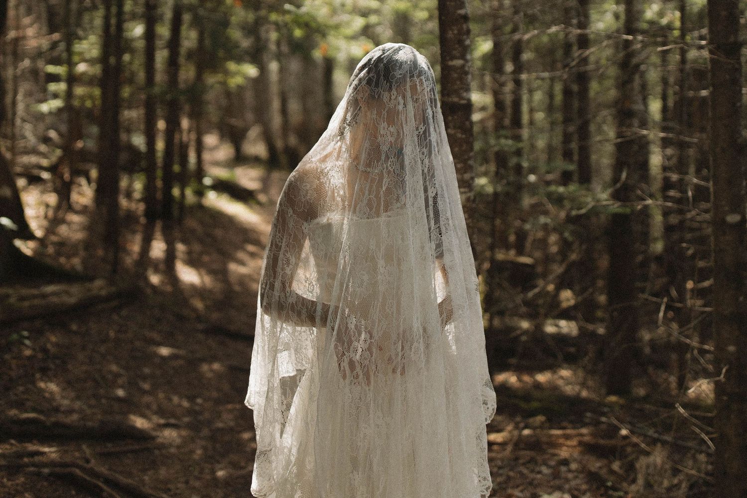 Wedding veil with floral crown photographed in soft natural light.