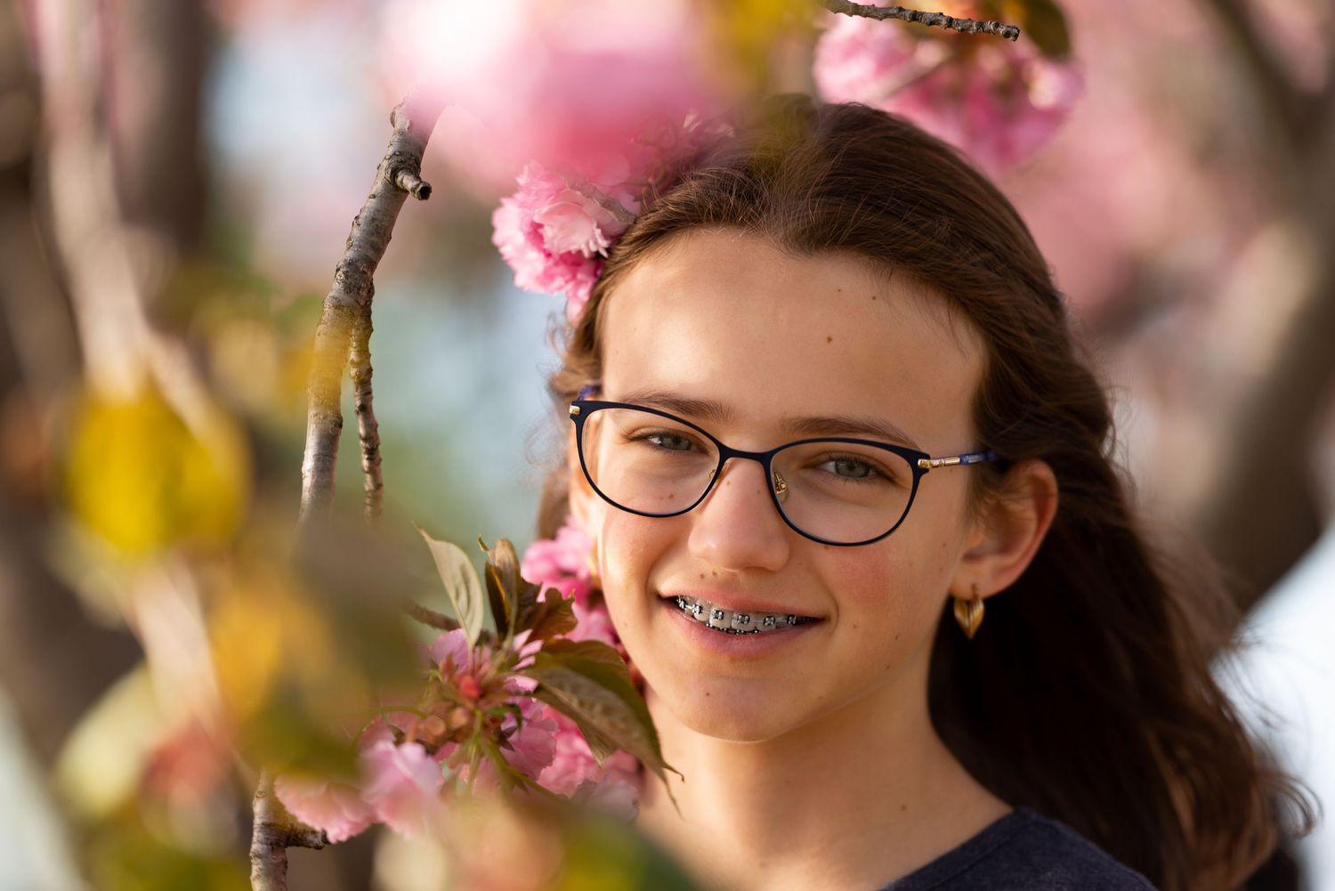 Teen portraits among cherry blossoms in Washington, DC on a beautiful spring day with Leah Ramuglia Photography.