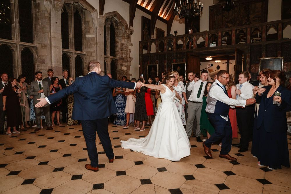 Berkeley Castle wedding venue Gloucestershire medieval castle evening reception main hall bride and groom first dance