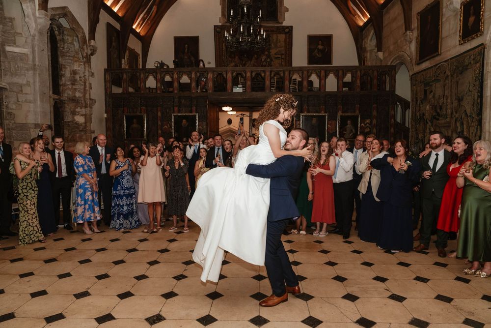 Berkeley Castle wedding venue Gloucestershire medieval castle evening reception main hall first dance for couple