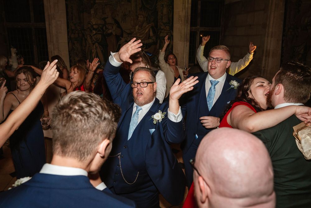 Berkeley Castle wedding venue Gloucestershire medieval castle evening reception main hall candids of guests dancing