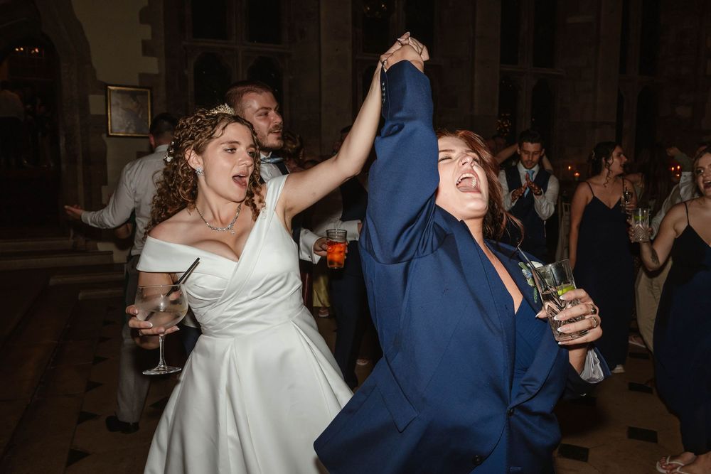 Berkeley Castle wedding venue Gloucestershire medieval castle evening reception main hall guests dancing