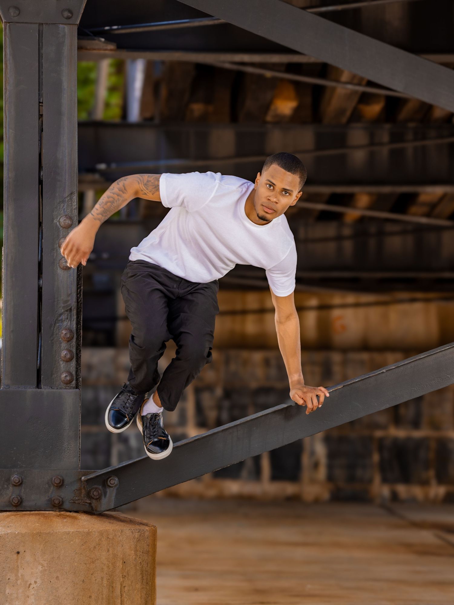 Model showing movement by jumping off a beam under a bridge