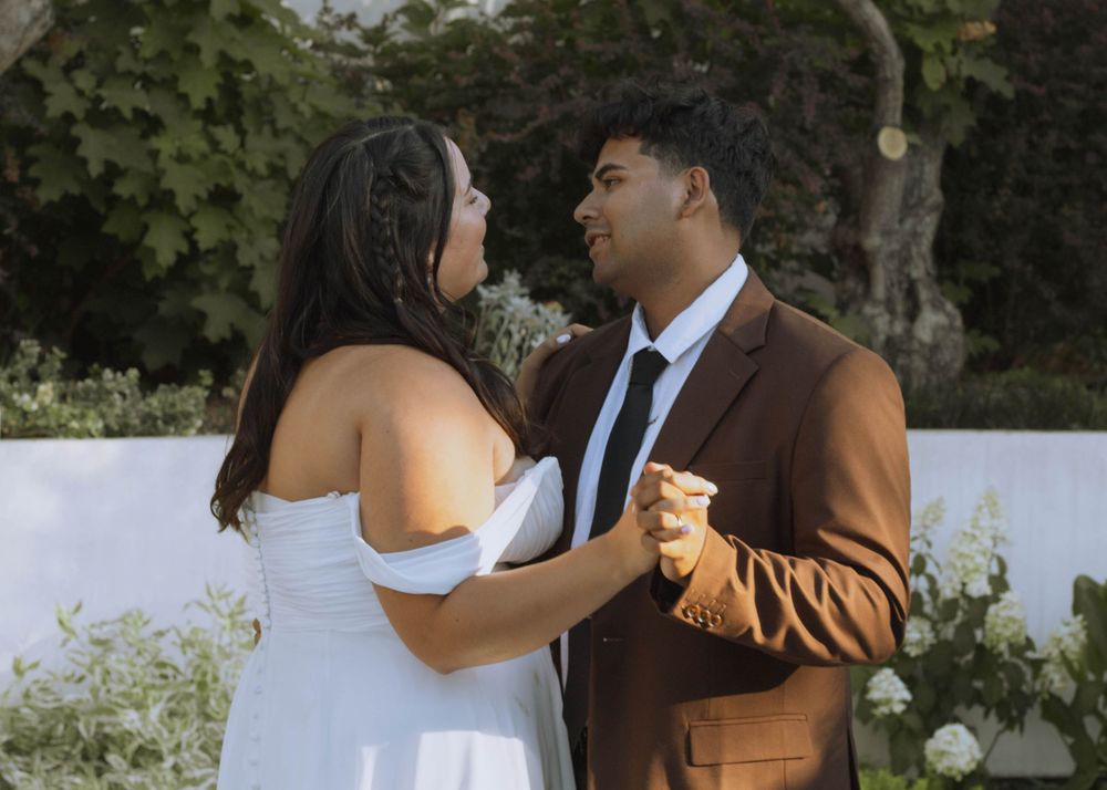 Bride and groom singing to one another while dancing on wedding day at Catelli's restaurant in Geyserville, CA.