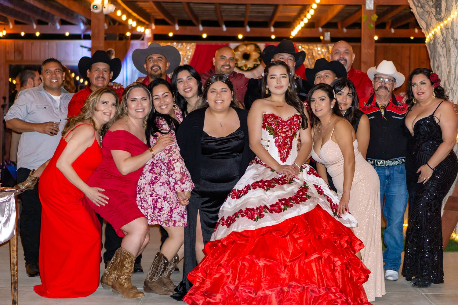 a group photo at a quinceanera reception