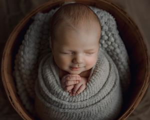 newborn baby boy swaddled in Aloha Oregon photo studio