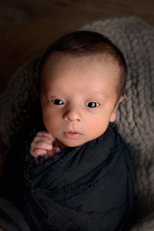 Close up of newborn baby face for newborn photoshoot photography studio