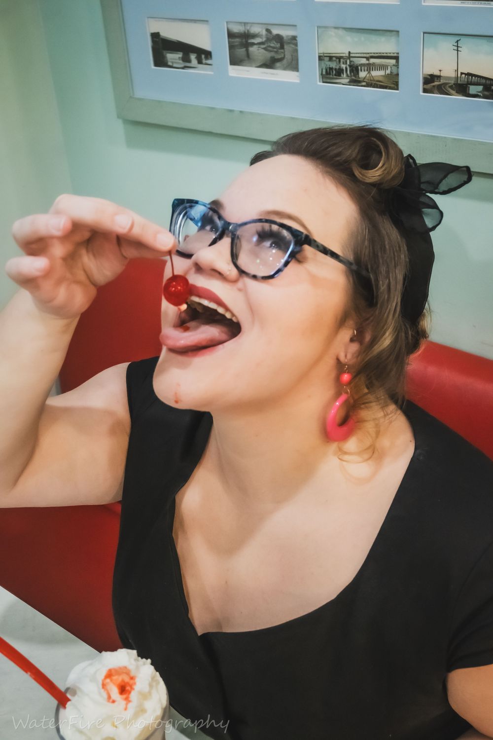 A sequence of candid shots showing someone drinking from a red cup in a room with blue walls.