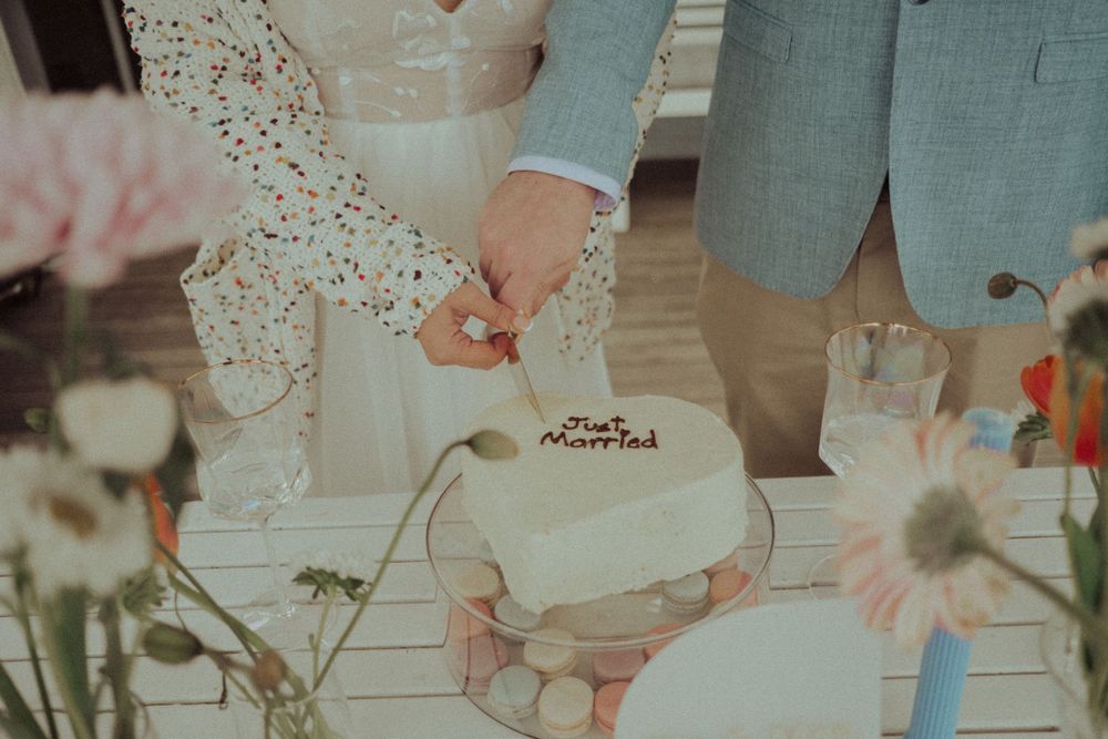 Close-up of wedding details with delicate floral arrangements and soft pastel colors.