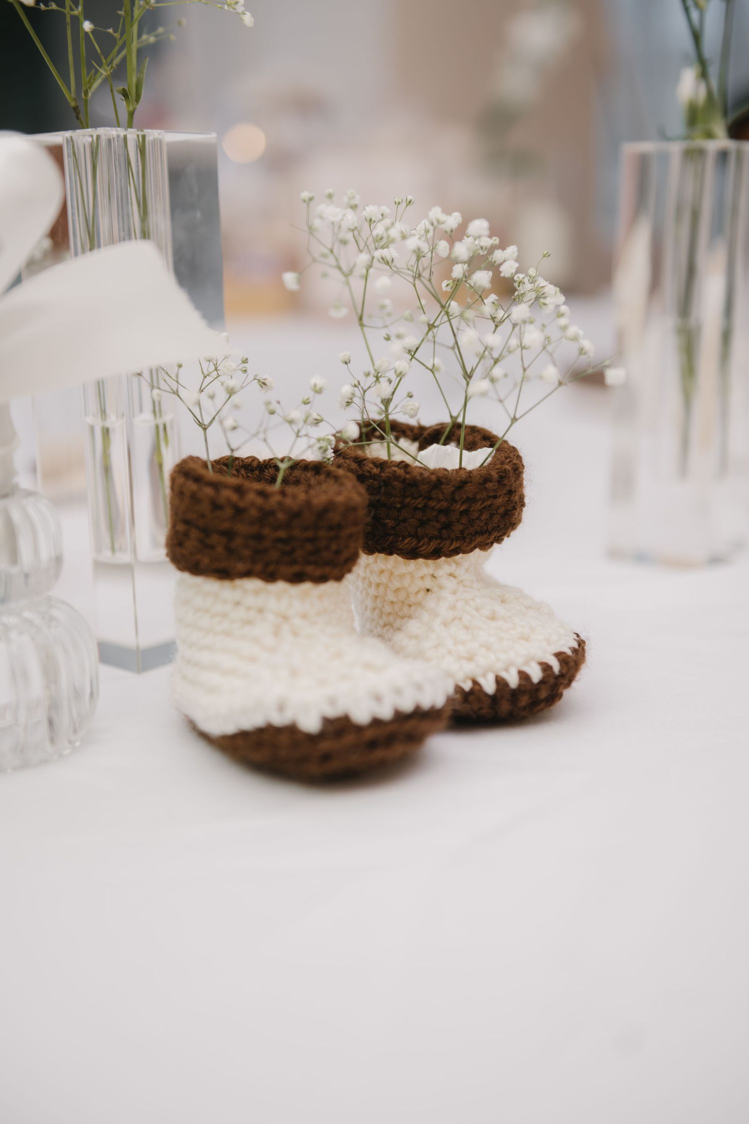knitted baby booties with flowers