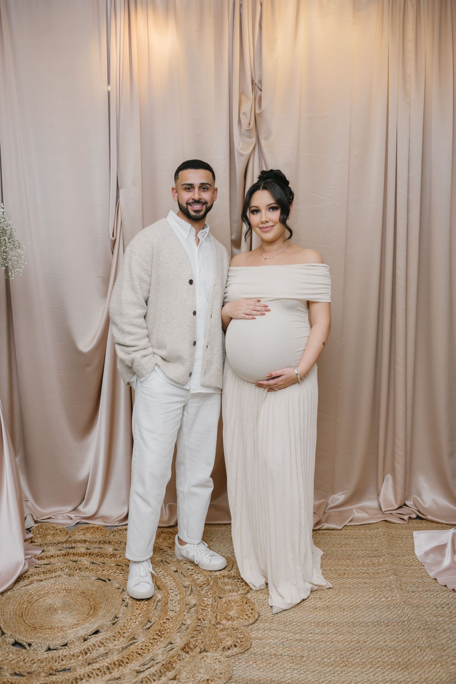 pregnant mom and husband standing side by side