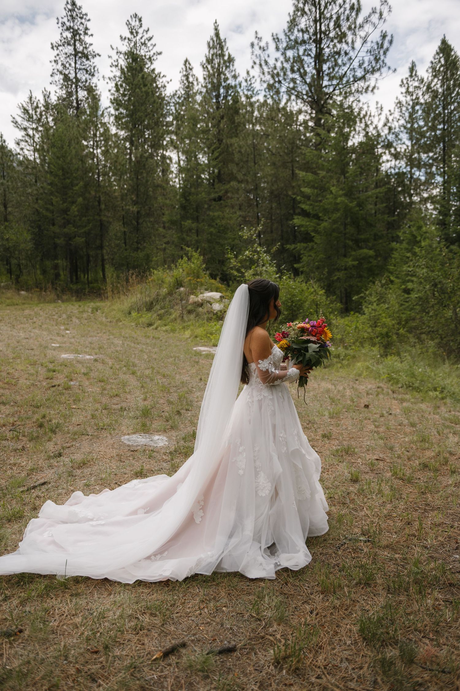 bride walking through the forest