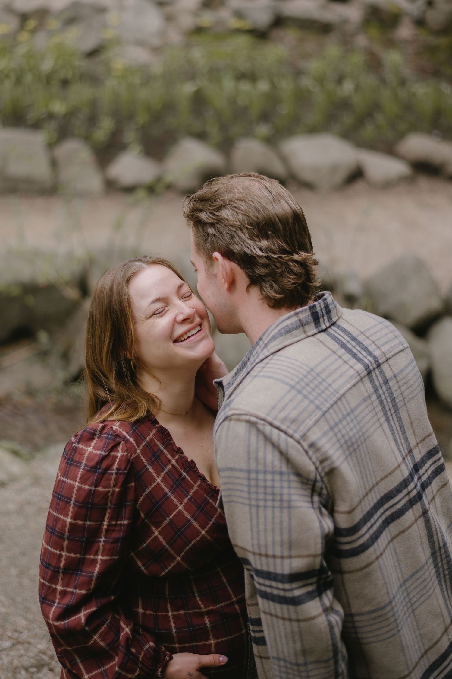 husband kissing his wife's cheek