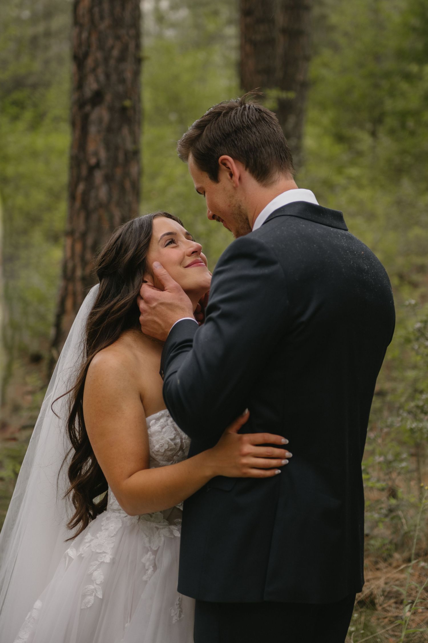 bride and groom looking into each others eyes