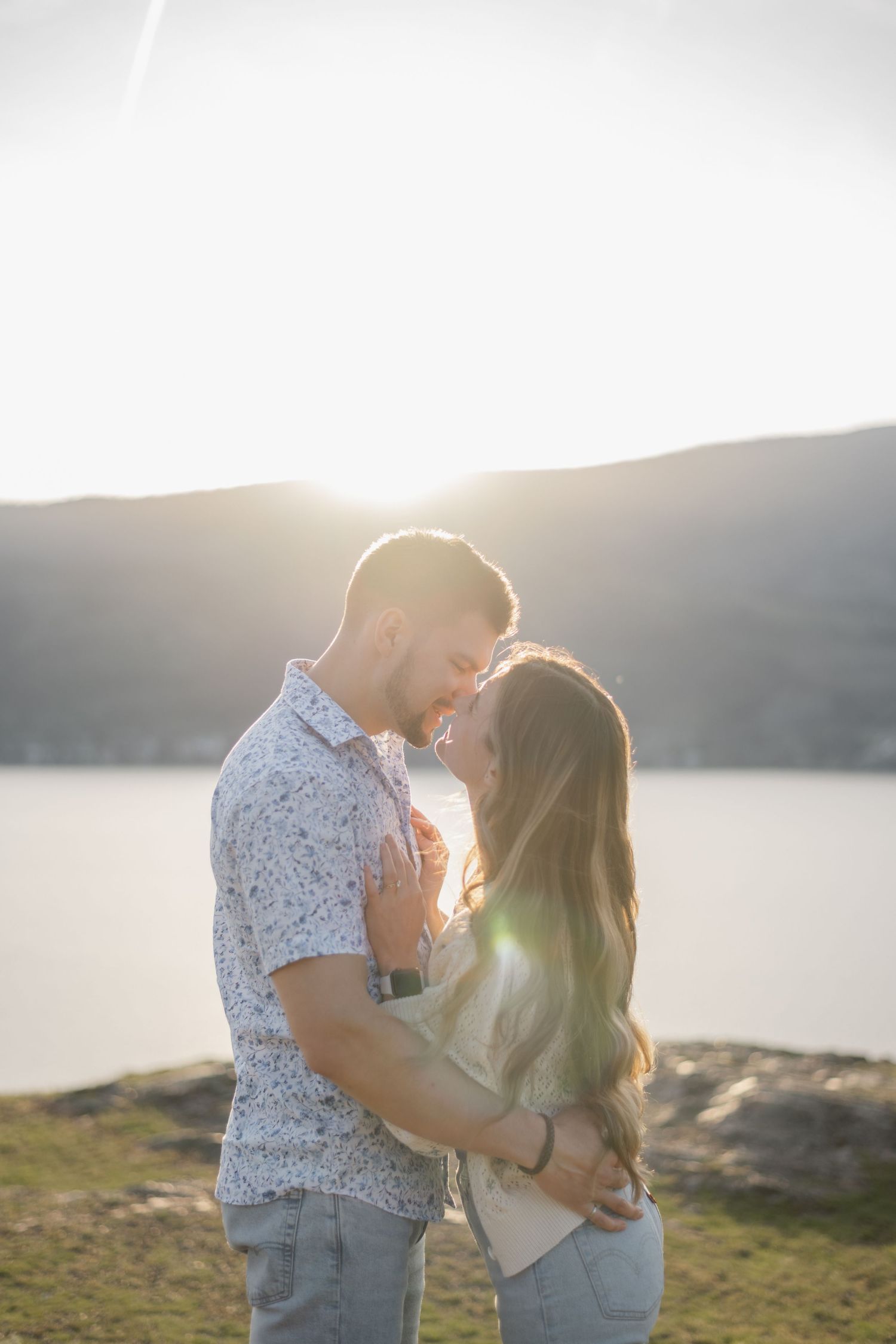 couple kissing during sunset