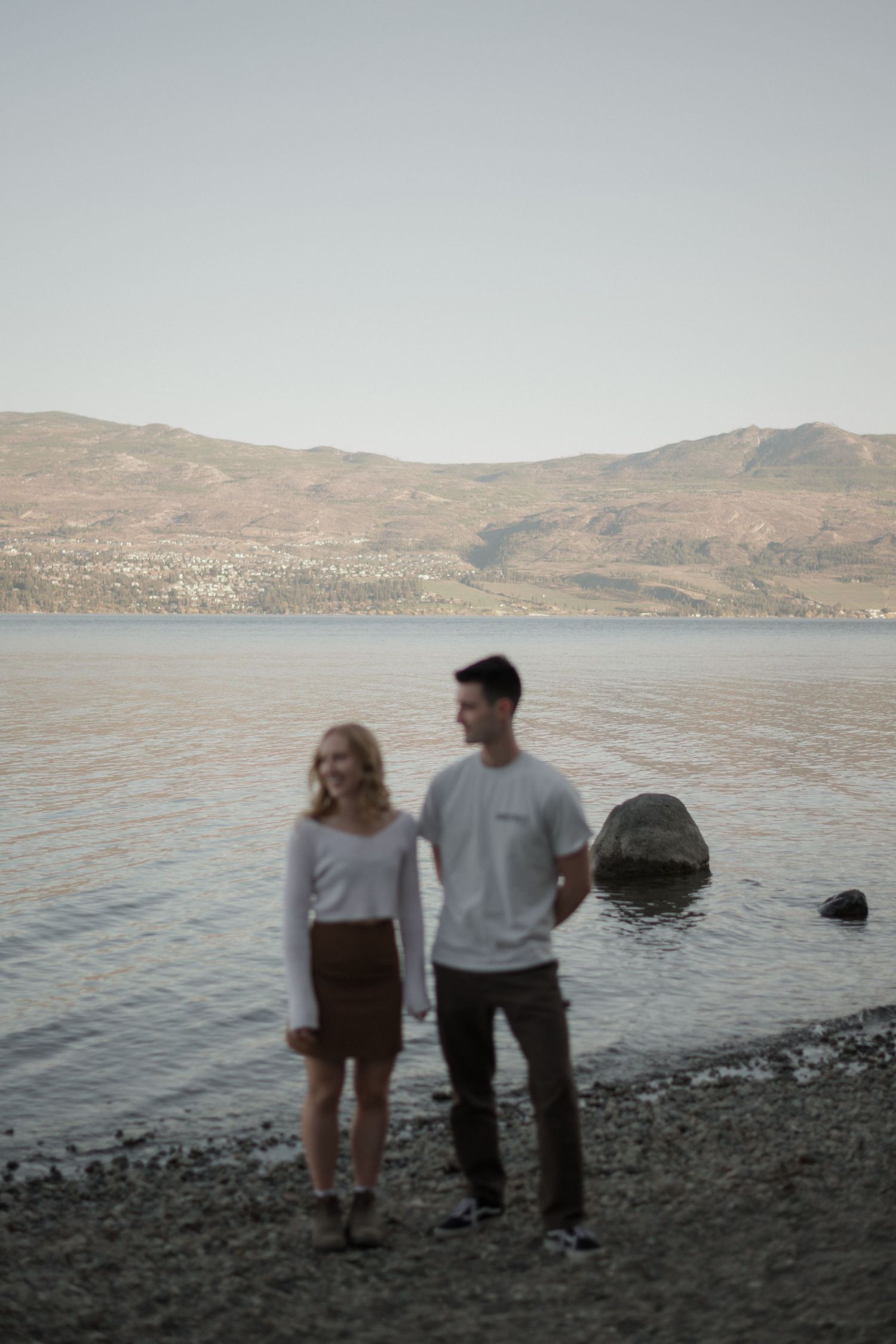 couple looking out at a lake in Kelowna
