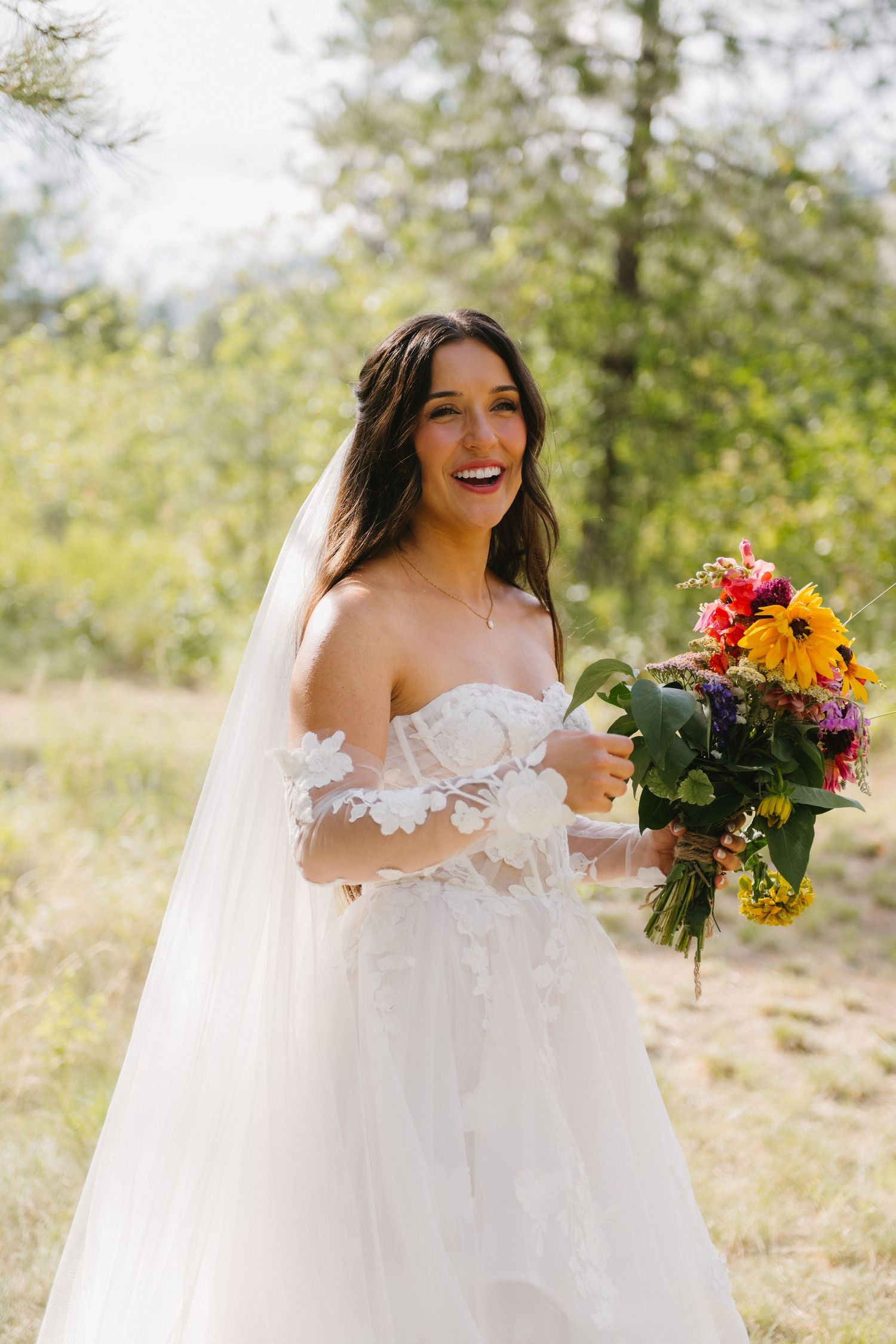 bride smiling and holding her flowers