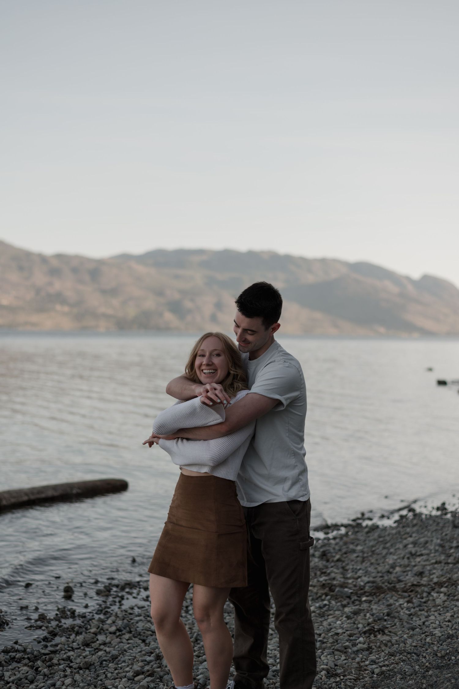 couple hugging by the lake