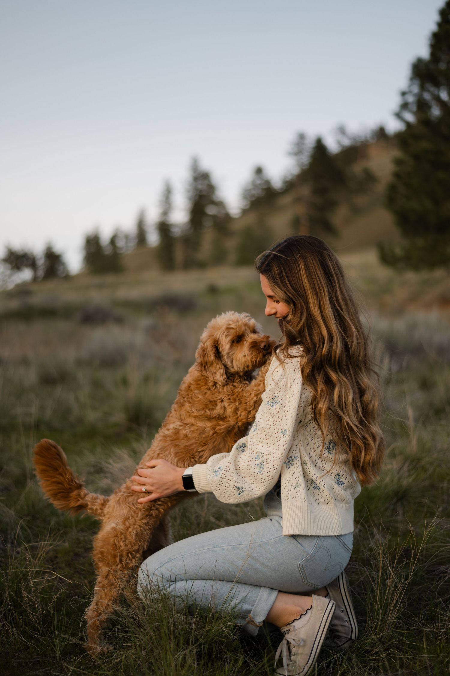 women and dog hugging
