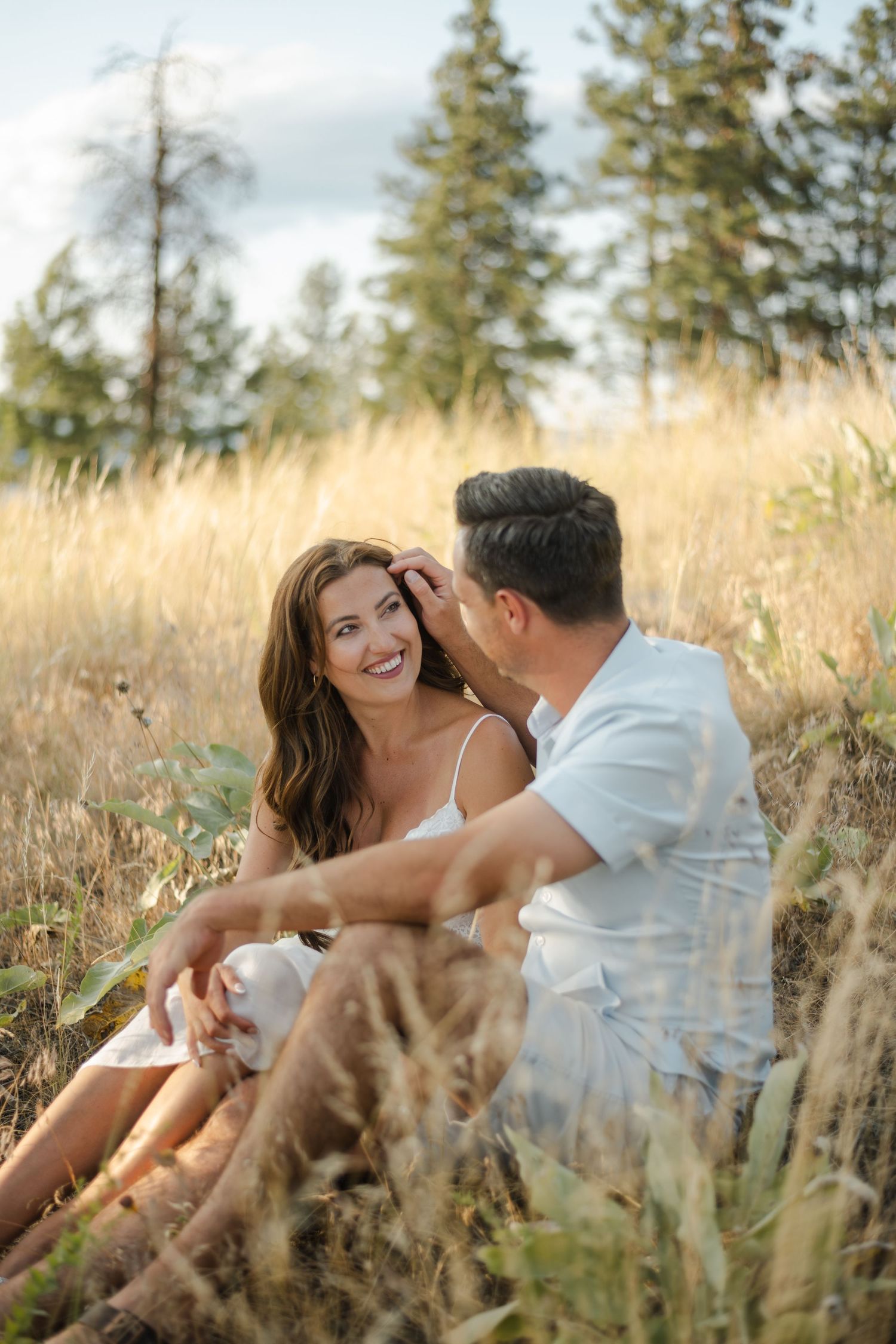 couple sitting in a field