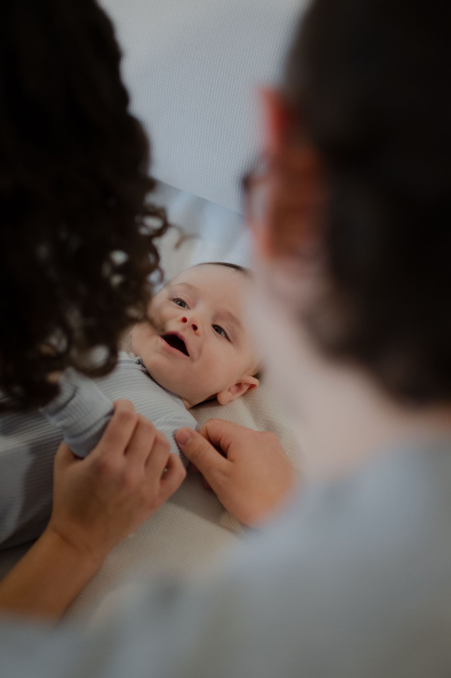 baby staring at mom and dad