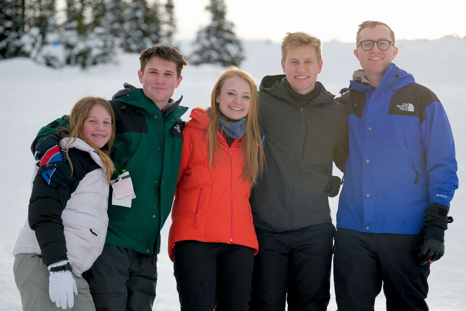 Group poses together on snowy mountain wearing winter sports gear.
Whistler Blackcomb