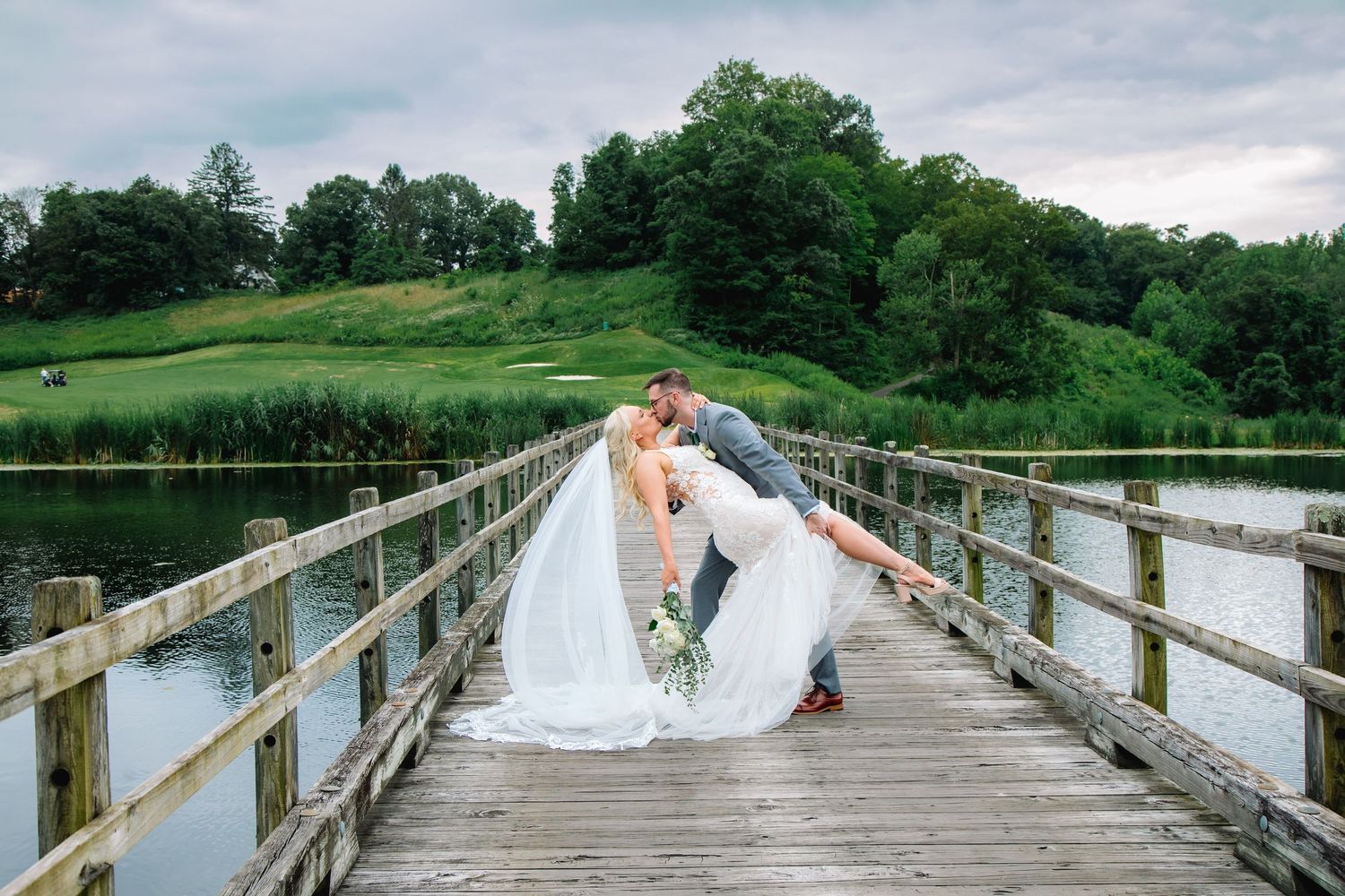 Hudson Valley Wedding at Hollowbrook Golf Club Wedding Photographer Jess Trankle Images photographs the Bride and Groom on a Bridge.