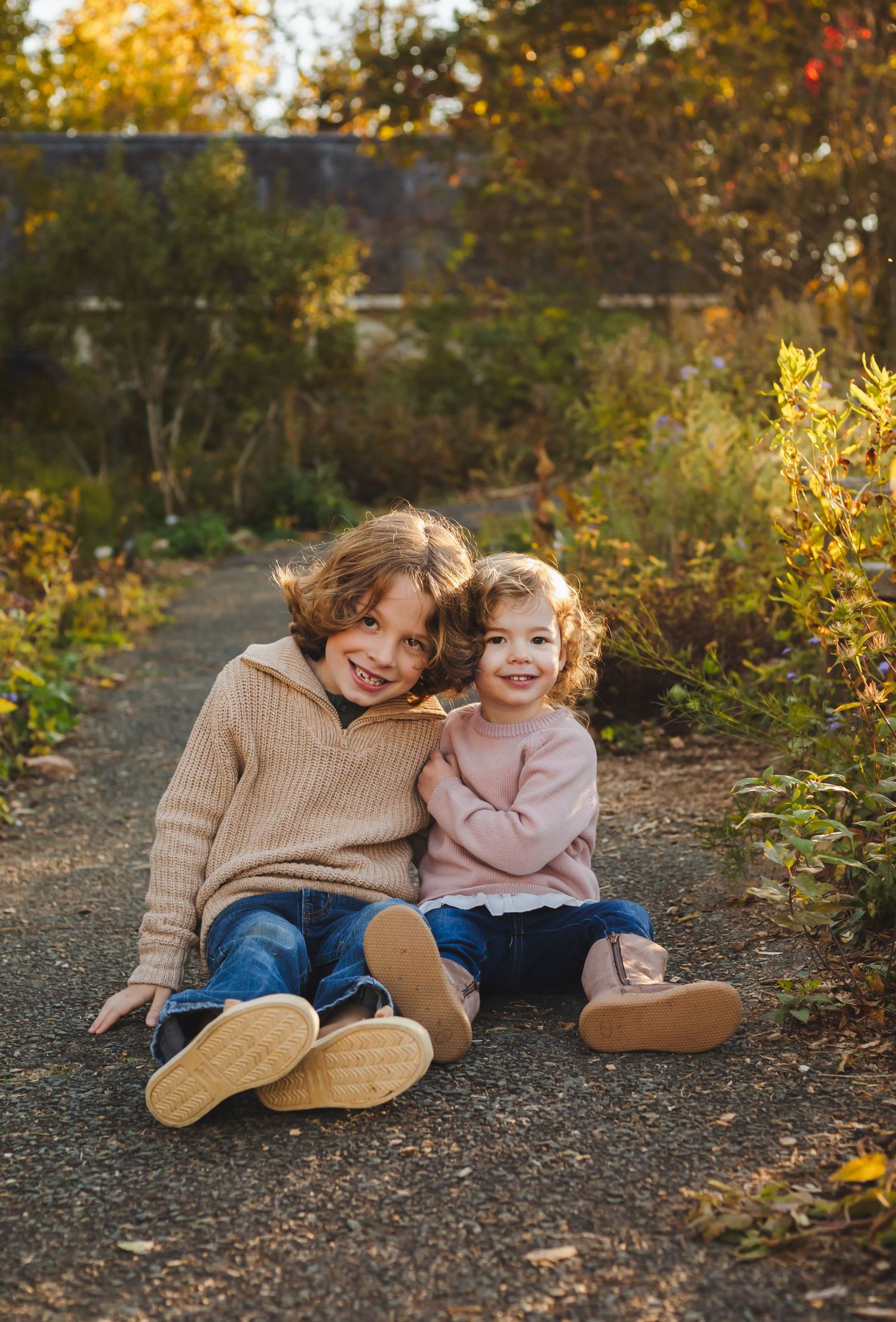 Charlottesville photographer, newborn, family, baby, maternity, brother and sister snuggling in fall flowers